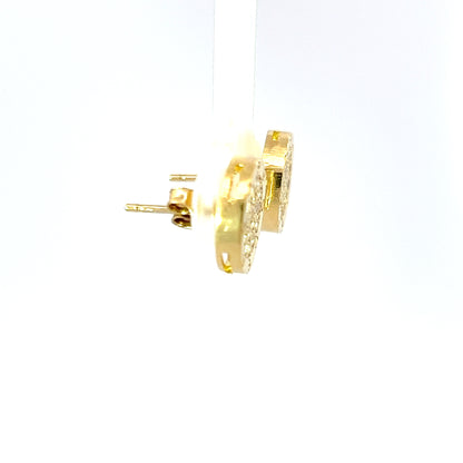 Elegantes aretes durmientes en oro amarillo de 10K con circonitas cúbicas de excelente calidad.