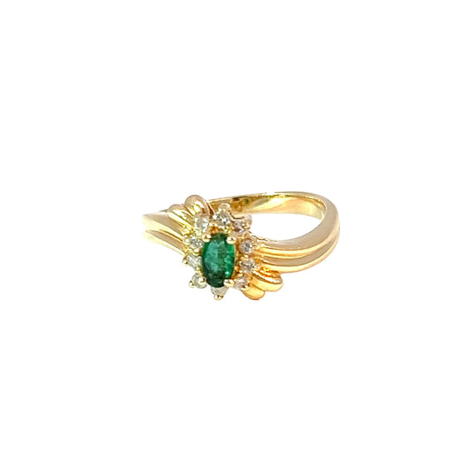 Exquisite multi-stone ring in 14 K yellow gold with oval cabochon emerald and natural diamonds