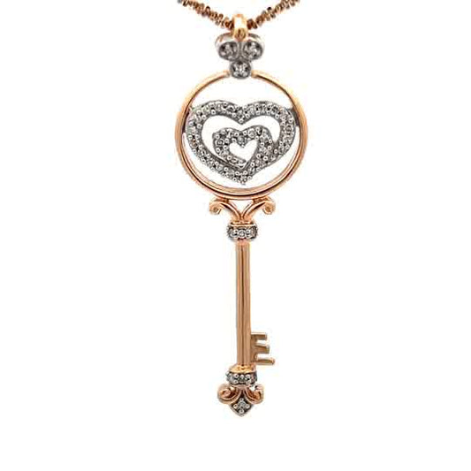 Heart-key charm in 14k gold, adorned with natural diamonds.