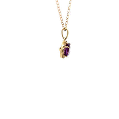 Colgante de oro amarillo de 10k con amatista morada y diamantes naturales de talla brillante