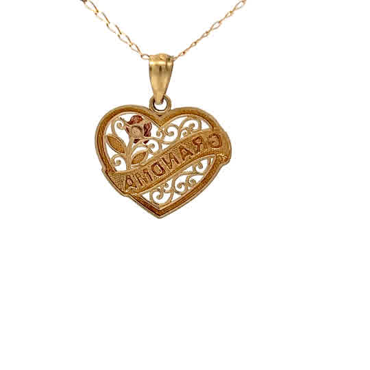 Colgante de oro amarillo de 10k con diseño de corazón y detalles en oro blanco y rosa.
