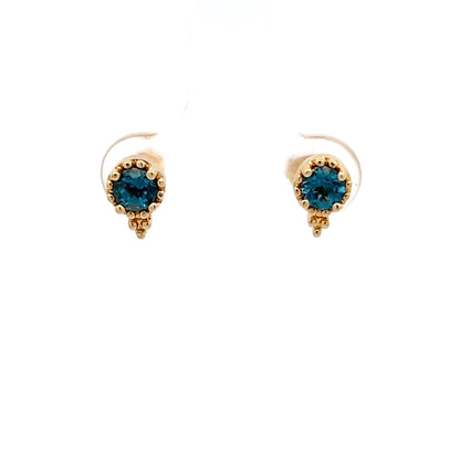 Pendientes de oro amarillo de 14k con topacio azul talla brillante