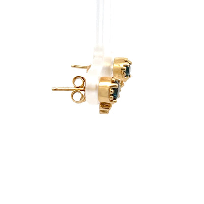 Pendientes de oro amarillo de 14k con topacio azul talla brillante