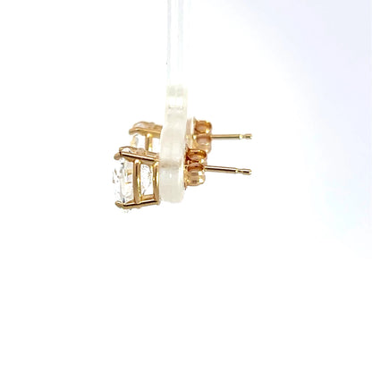 Pendientes de oro amarillo de 14k con topacio azul talla brillante