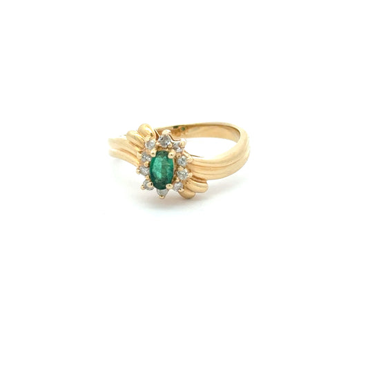 Exquisite multi-stone ring in 14K yellow gold with oval cabochon emerald and natural diamonds