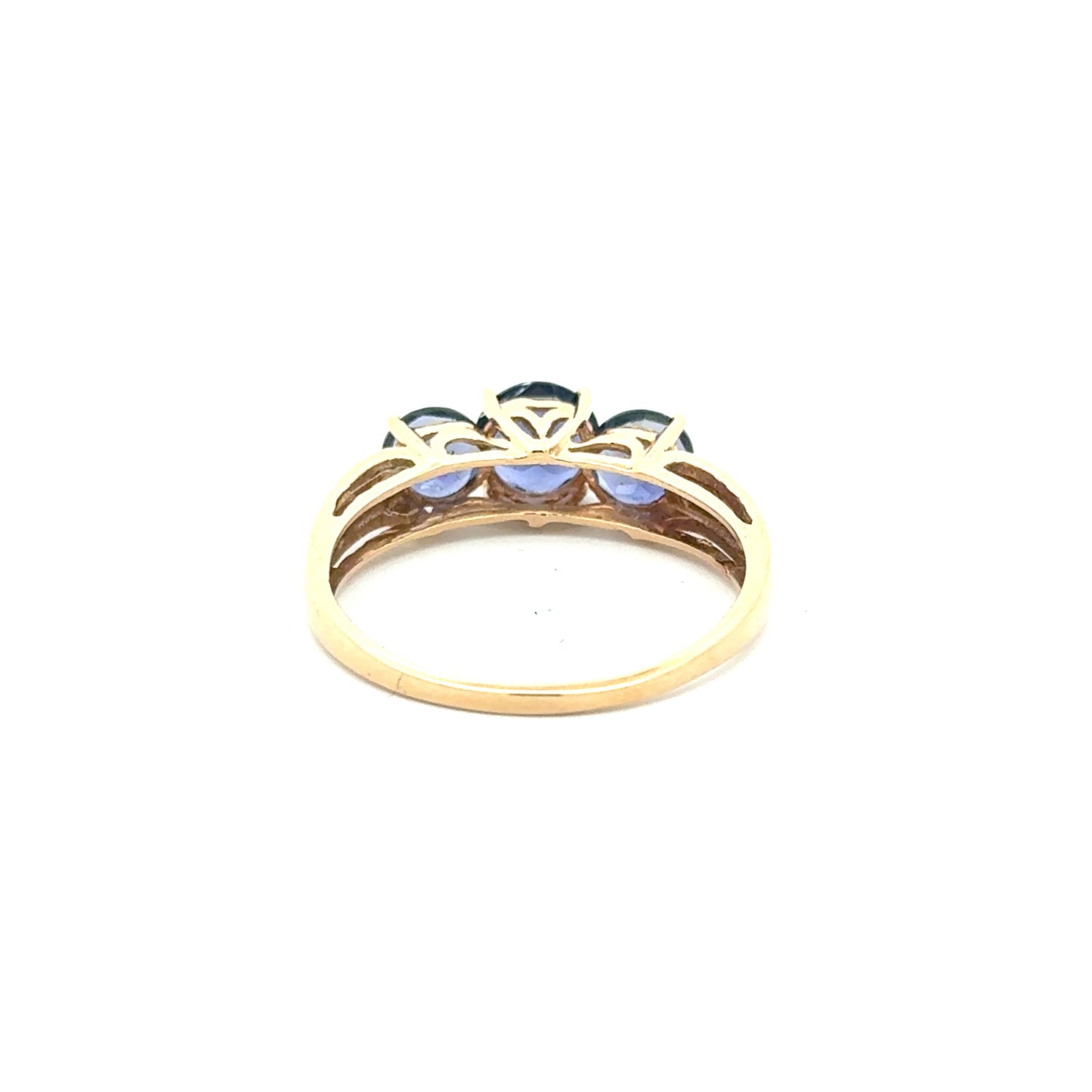 10K yellow gold ring with a trio of tanzanites and small diamonds