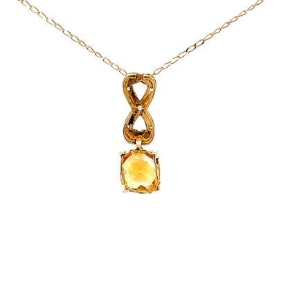 Elegant 10K yellow gold pendant with cushion-cut citrine and small diamonds
