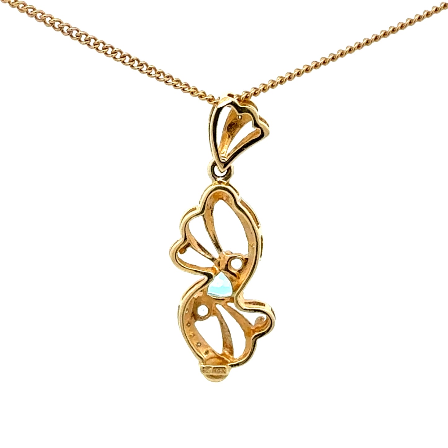 14k yellow gold pendant with a blue topaz