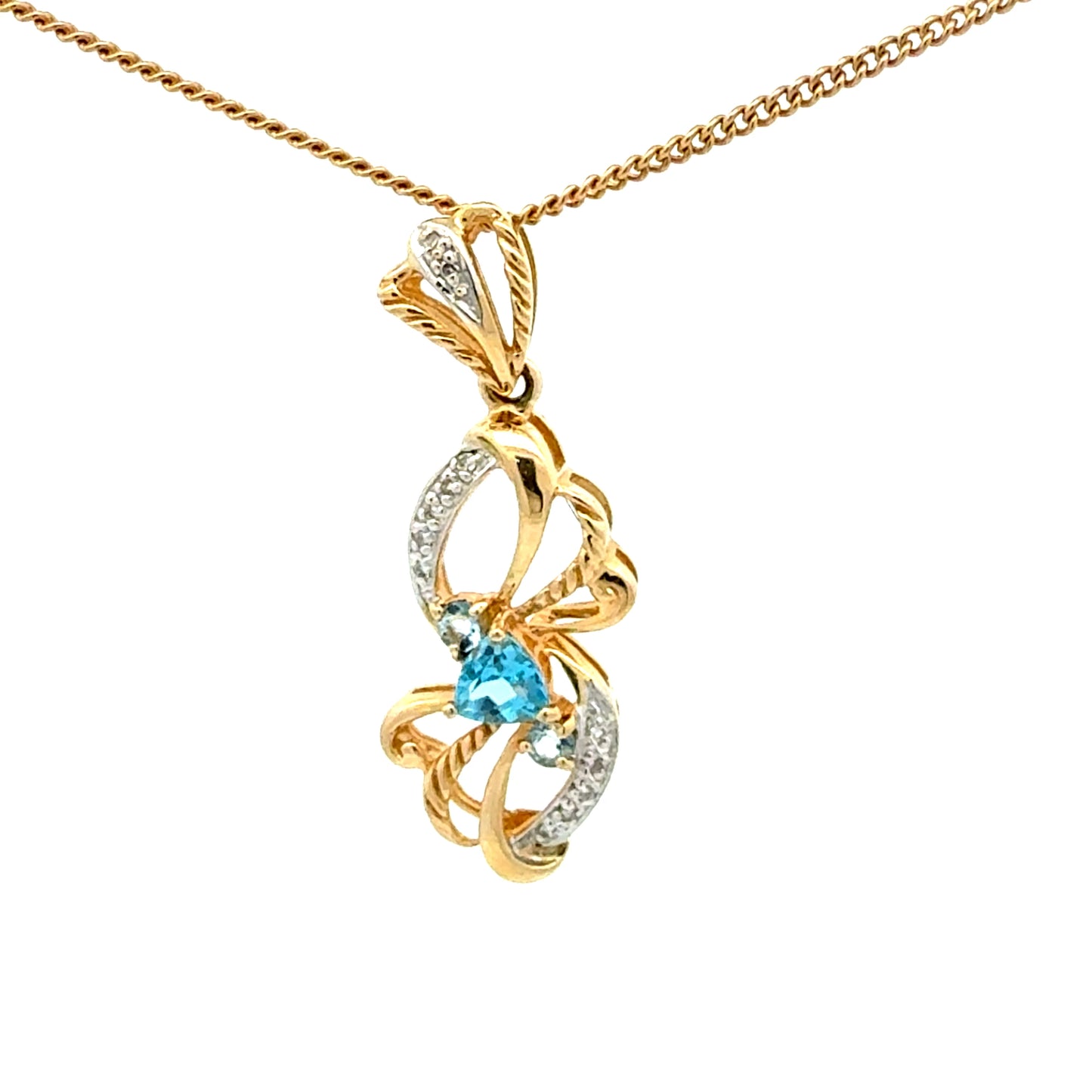 14k yellow gold pendant with a blue topaz