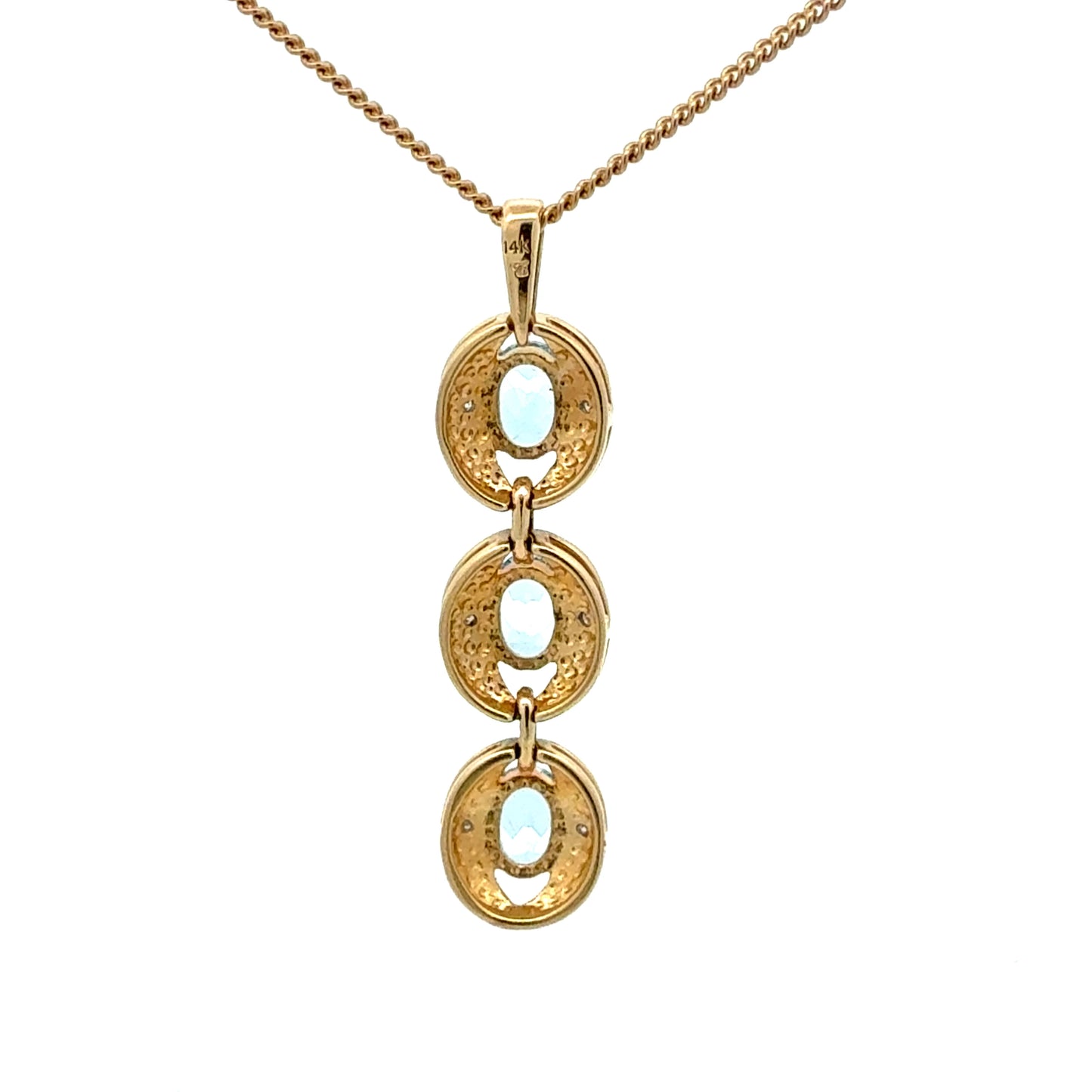 14k gold pendant with three aquamarine stones