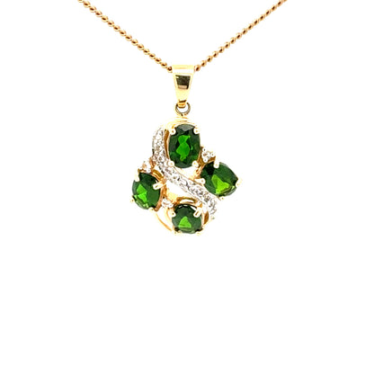 14k gold pendant with peridot and diamond stones