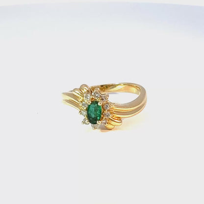 Exquisite multi-stone ring in 14K yellow gold with oval cabochon emerald and natural diamonds