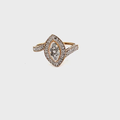 10k Yellow Gold Ring with natural diamonds set in a marquise shape and brilliant accents
