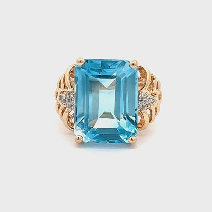 Exquisite 14k yellow gold ring with emerald-cut blue aquamarine